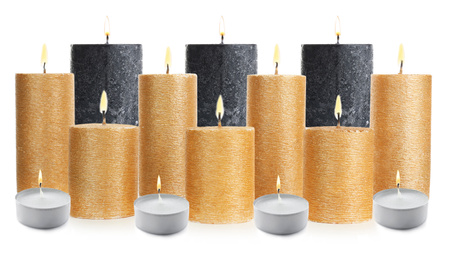 Image of Set of different burning candles on white background. Banner design