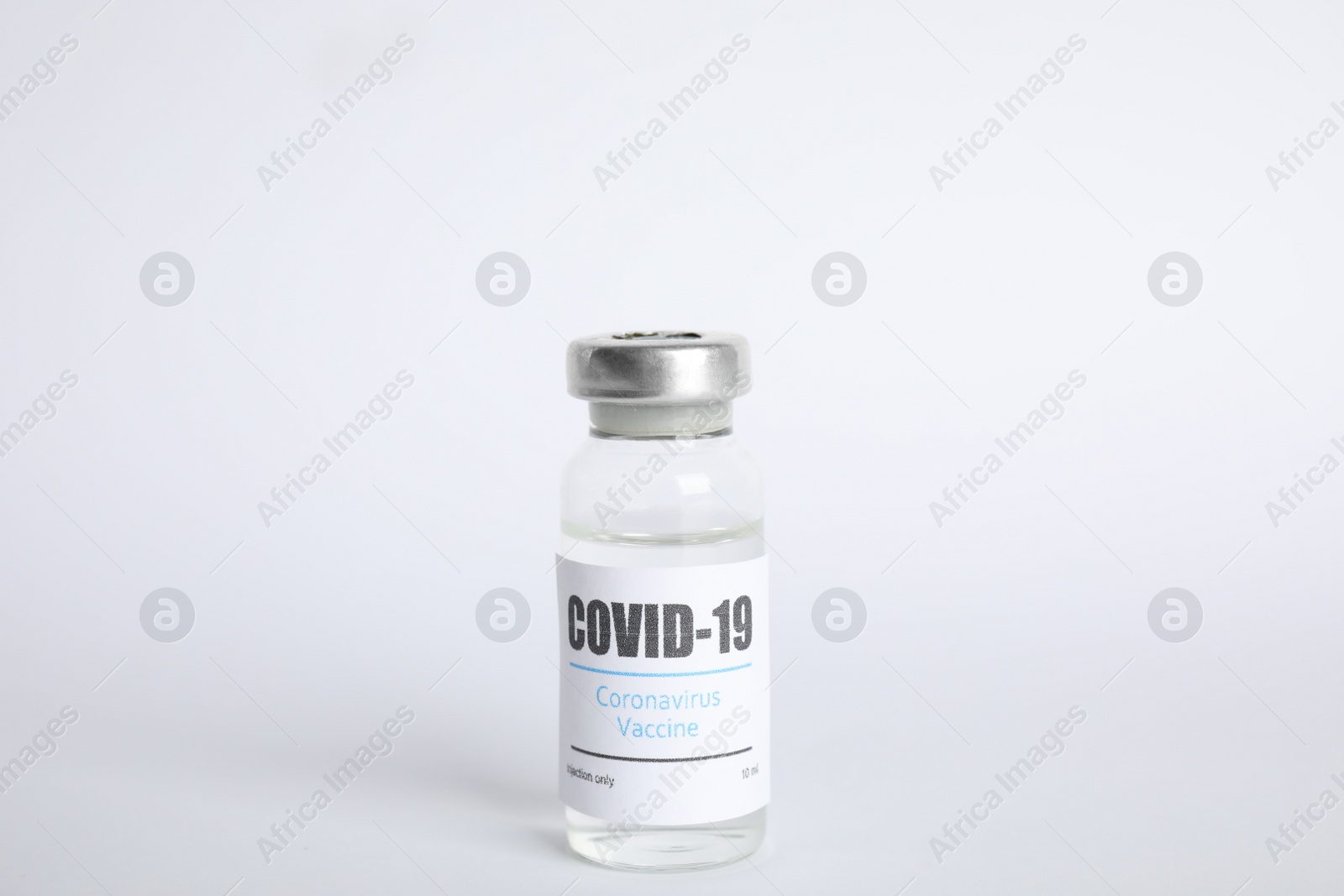 Photo of Vial with coronavirus vaccine on white background