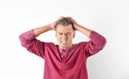 Photo of Handsome emotional young man on white background