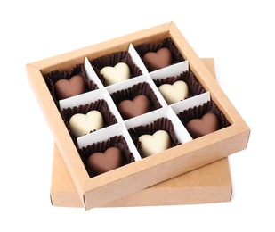 Photo of Tasty heart shaped chocolate candies in box isolated on white. Valentine's day celebration