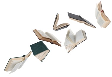 Image of Many hardcover books flying on white background