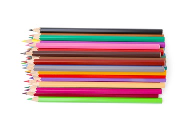 Pile of colorful wooden pencils on white background, top view