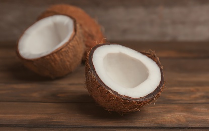 Fresh yummy coconuts on wooden table