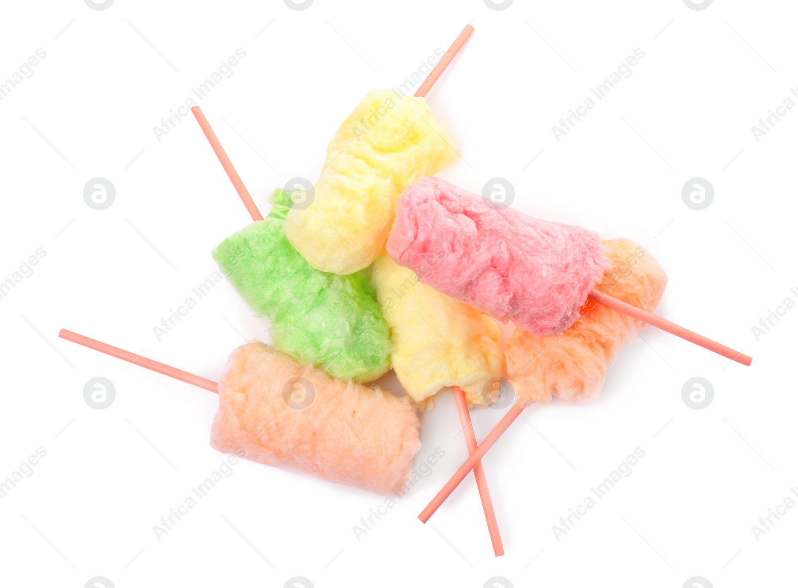 Photo of Straws with yummy cotton candy on white background, top view
