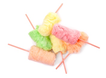 Photo of Straws with yummy cotton candy on white background, top view