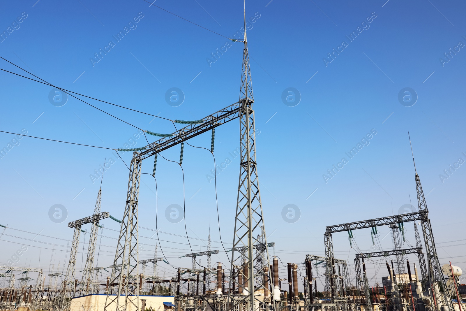 Photo of Modern electrical substation on sunny day, low angle view