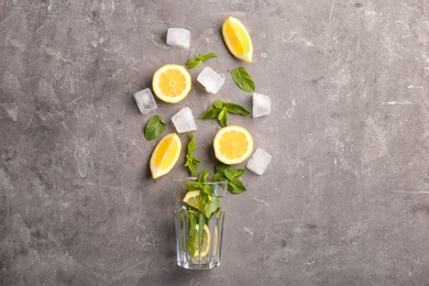 Photo of Flat lay composition with ingredients for detox lemonade on grey background