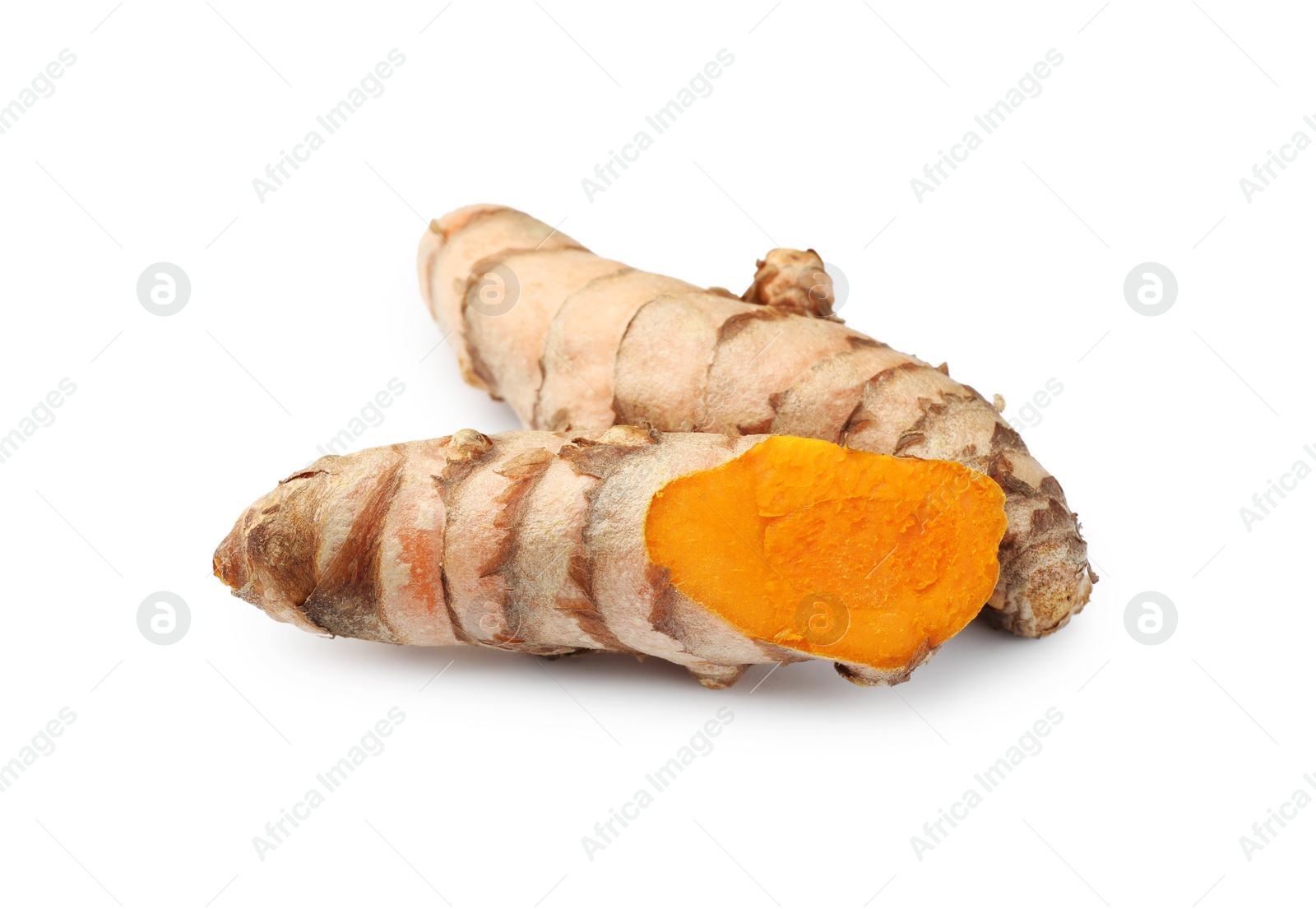 Photo of Fresh whole and cut turmeric roots isolated on white