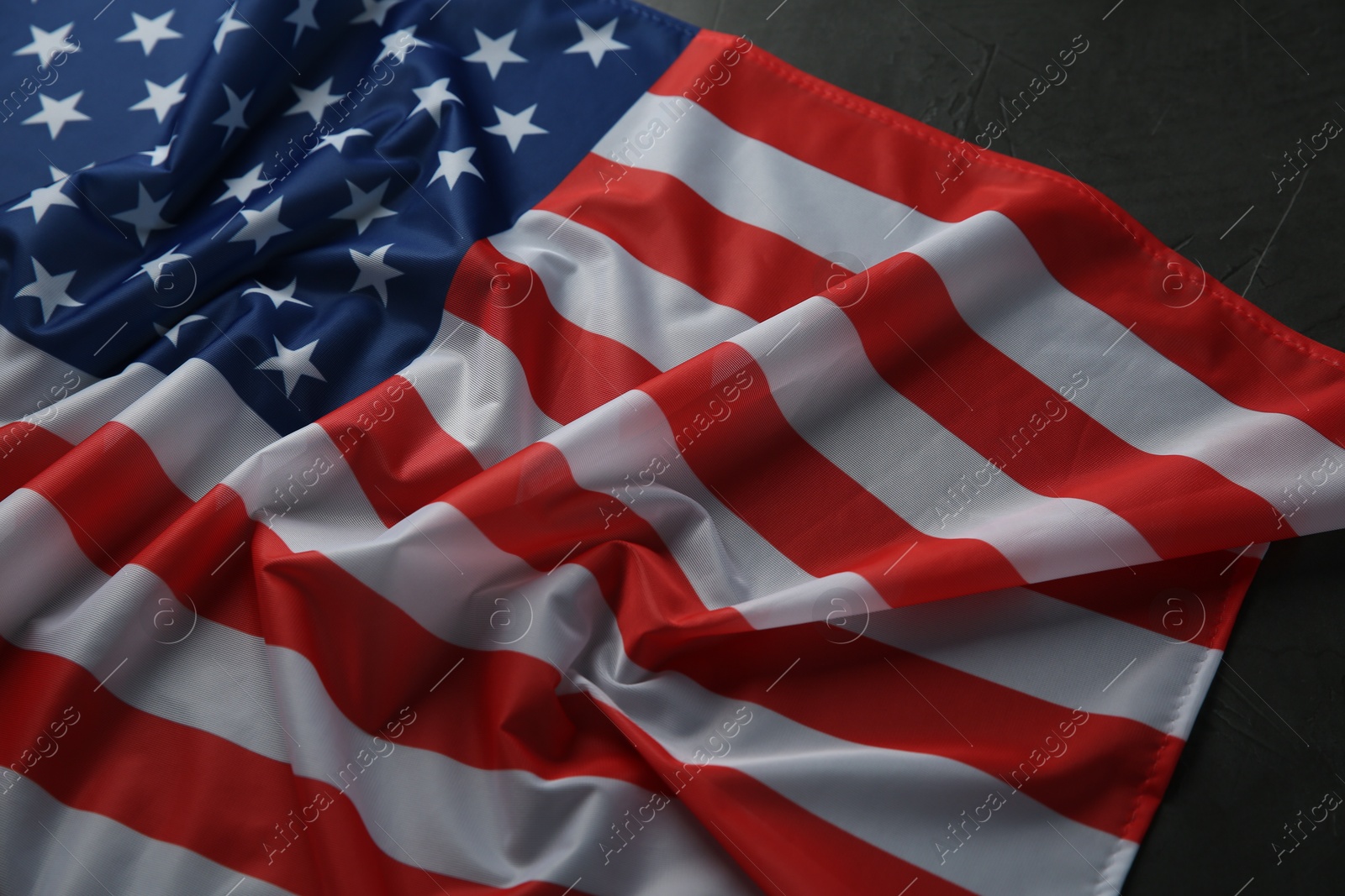 Photo of Flag of USA on black table, above view