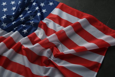 Flag of USA on black table, above view