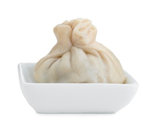 Photo of One tasty khinkali (dumpling) in bowl isolated on white. Georgian cuisine