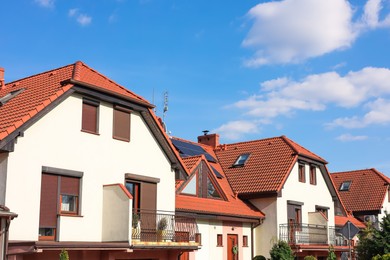 Block of houses outdoors on sunny day