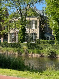 Beautiful view of building near river outdoors on sunny day