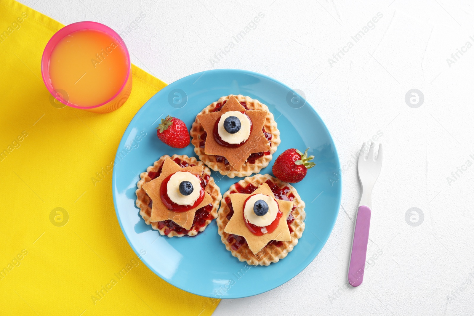 Photo of Tasty dessert served with juice on white table, flat lay. Creative idea for kids breakfast