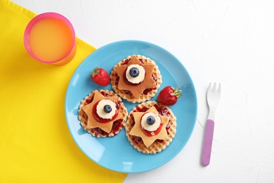 Photo of Tasty dessert served with juice on white table, flat lay. Creative idea for kids breakfast