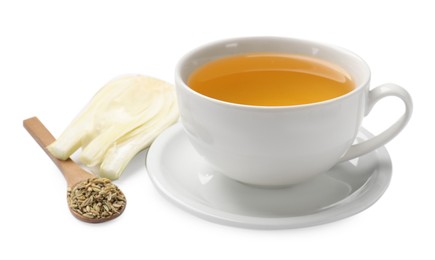 Photo of Aromatic fennel tea in cup, seeds, fresh vegetable and spoon isolated on white