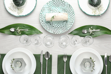 Photo of Elegant festive setting on white wooden table, flat lay