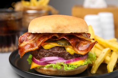 Photo of Tasty burger with bacon, vegetables and patty served with french fries on light grey table, closeup