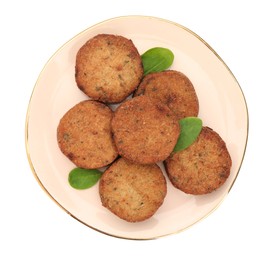Photo of Plate of delicious vegan cutlets and spinach isolated on white, top view