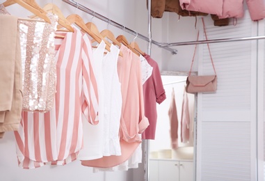 Photo of Modern dressing room with different stylish clothes and accessories