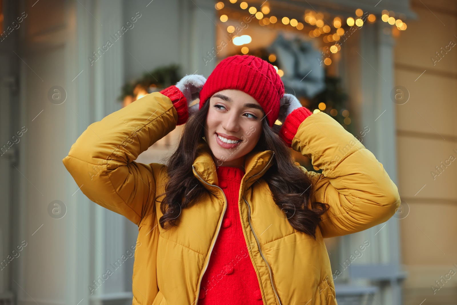 Photo of Portrait of smiling woman on city street in winter