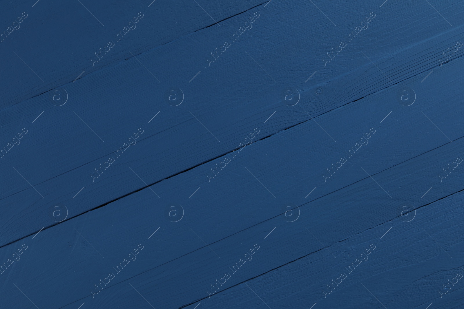 Photo of Texture of dark blue wooden surface as background, closeup