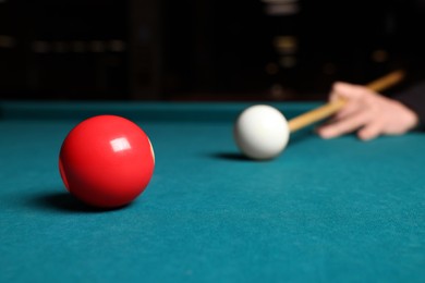 Photo of Man playing billiard at green table, closeup. Space for text