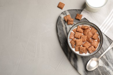 Photo of Bowl with tasty corn pads and milk on light table, flat lay. Space for text