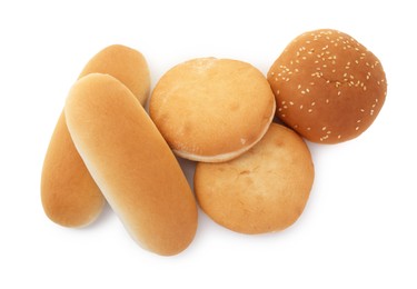 Tasty fresh burger and hotdog buns isolated on white, top view