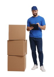 Photo of Happy young courier with stack of parcels and clipboard on white background