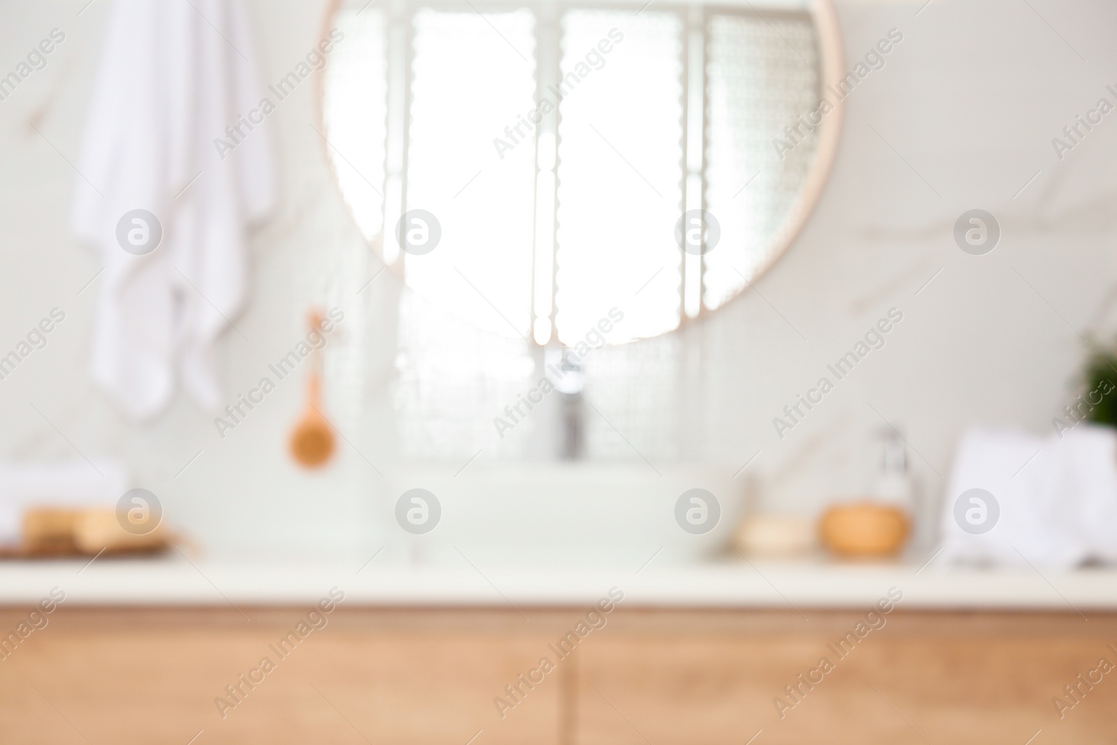 Photo of Blurred view of stylish modern bathroom with mirror