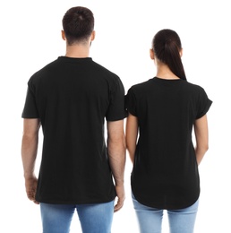 Photo of Young couple in t-shirts on white background. Mockup for design