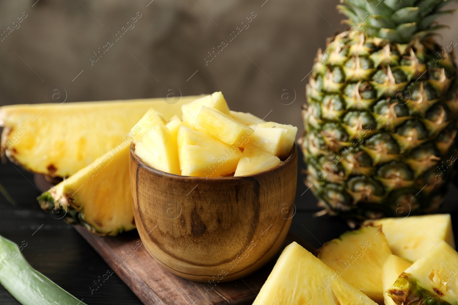 Photo of Bowl with fresh sliced pineapple, closeup