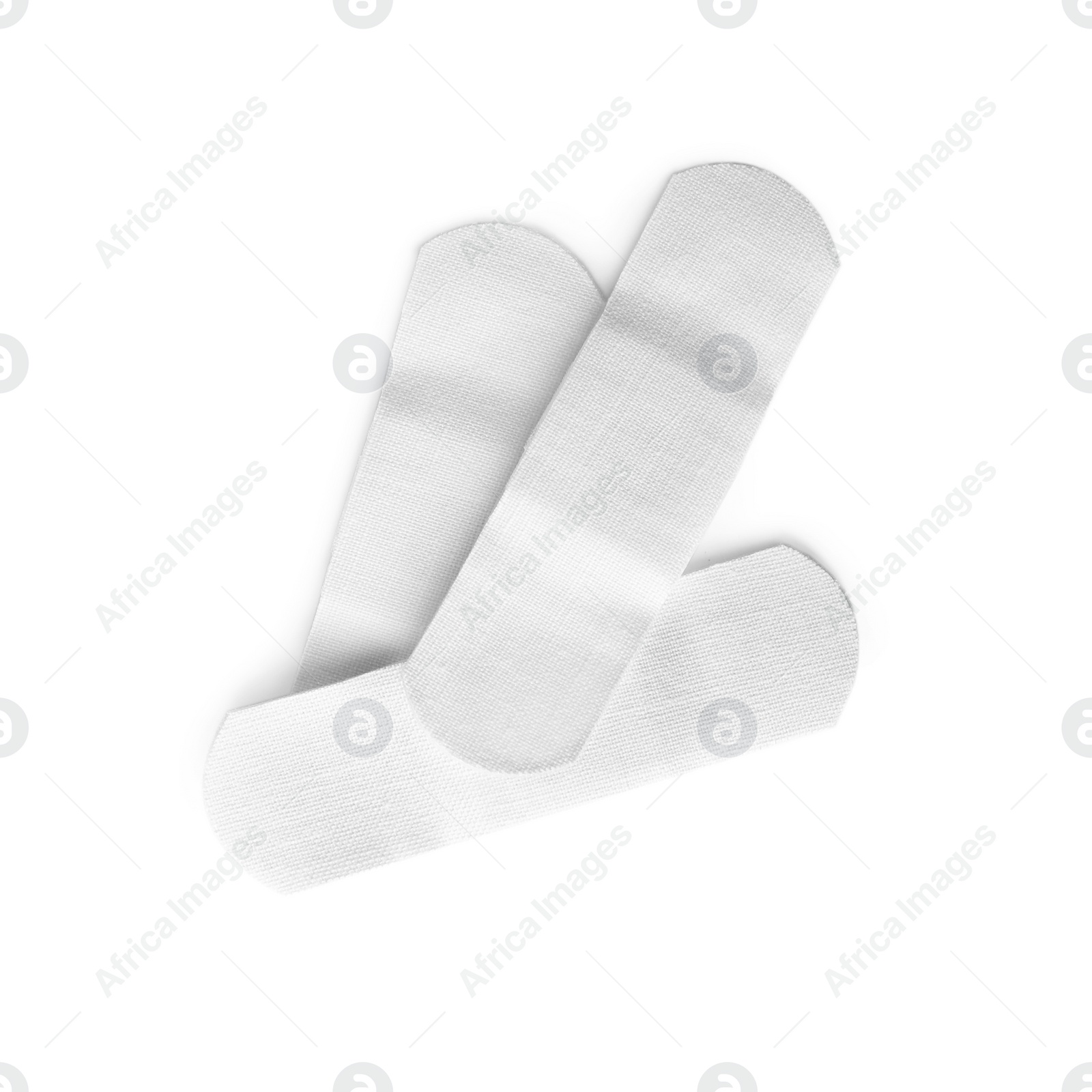 Medical sticking plasters isolated on white. First aid item Photo of Medical sticking plasters isolated on white. First aid item