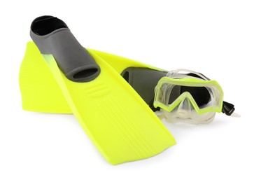 Photo of Pair of yellow flippers and diving mask isolated on white. Sports equipment