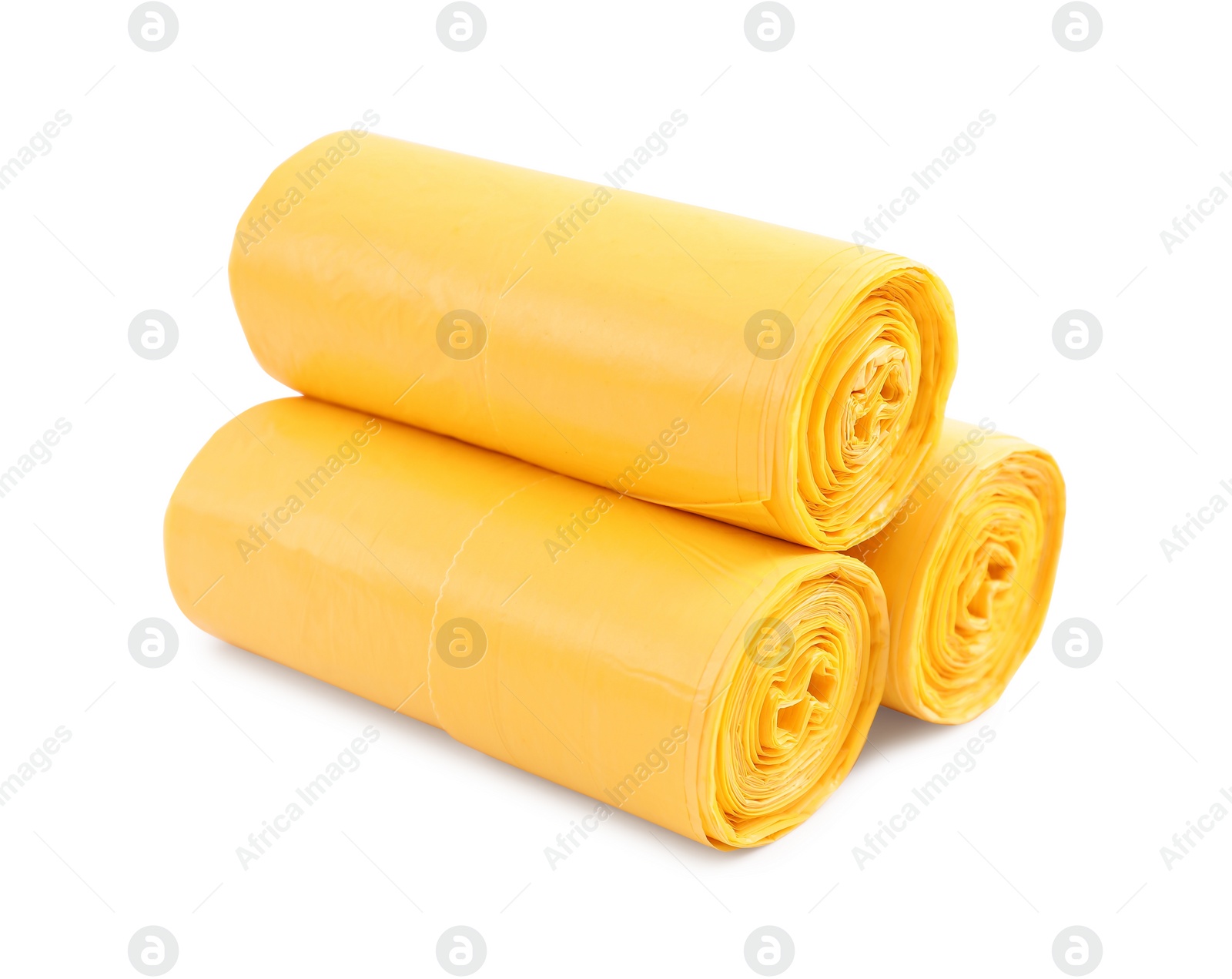 Photo of Rolls of yellow garbage bags isolated on white