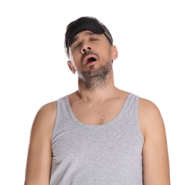 Man with eye mask in sleepwalking state on white background