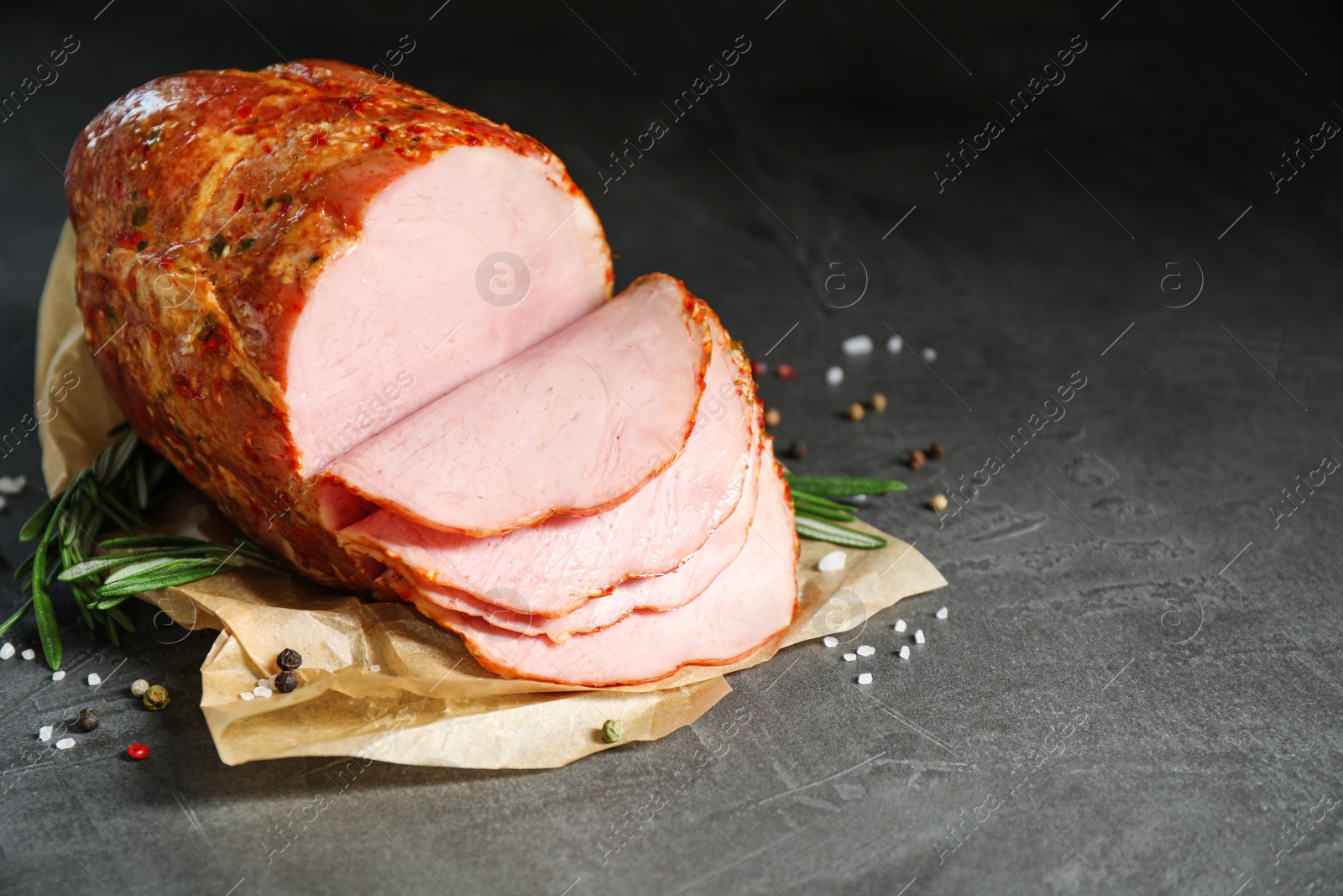 Photo of Delicious ham on grey table, space for text. Christmas dinner