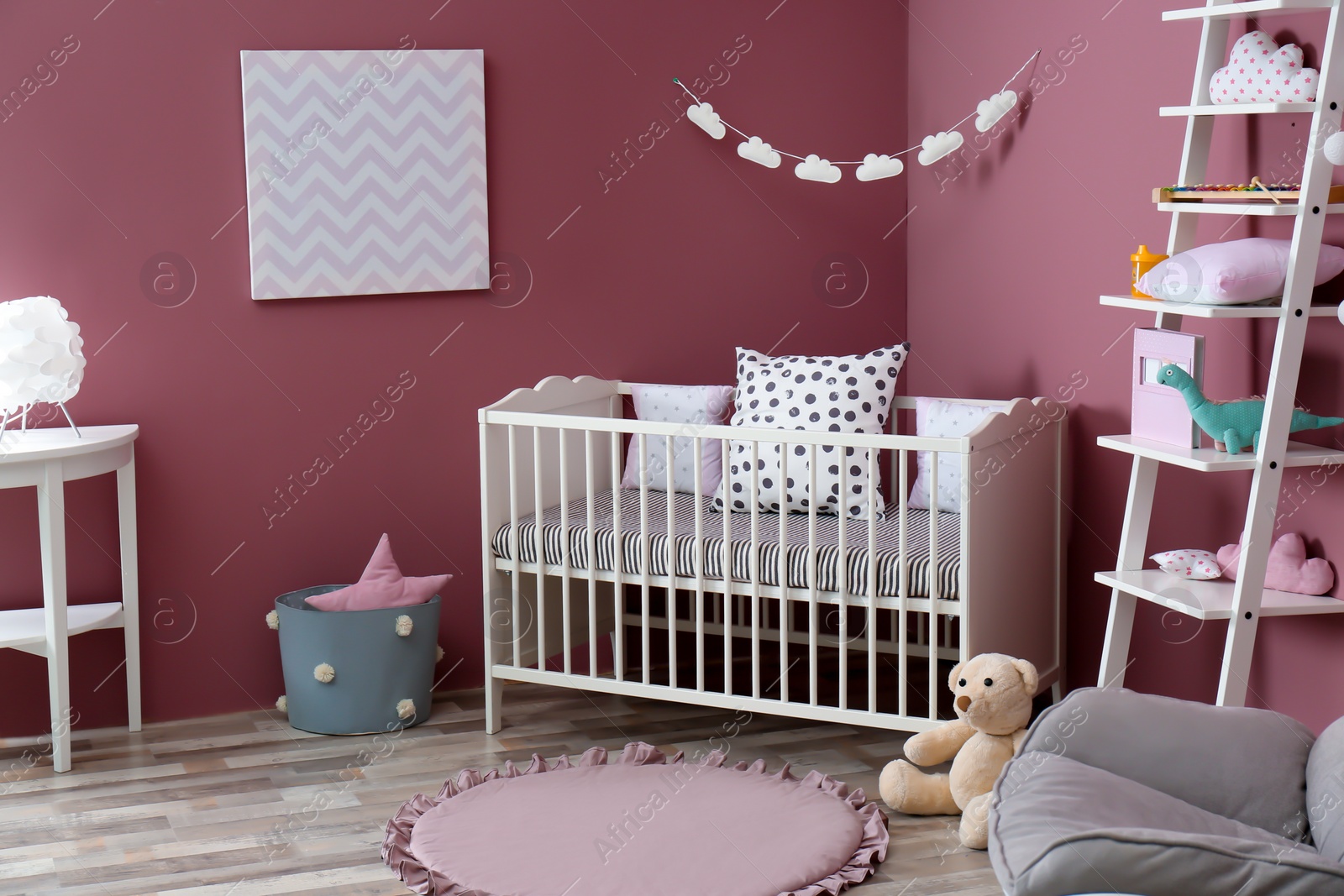 Photo of Stylish baby room interior with crib