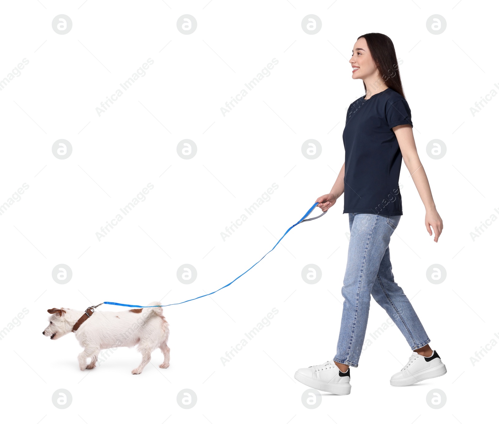 Image of Smiling woman walking with dog on white background