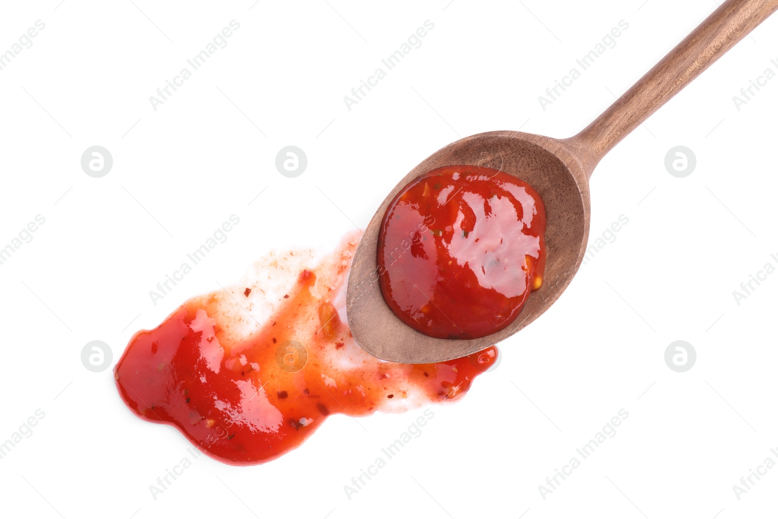 Photo of Wooden spoon and red sauce on white background, top view