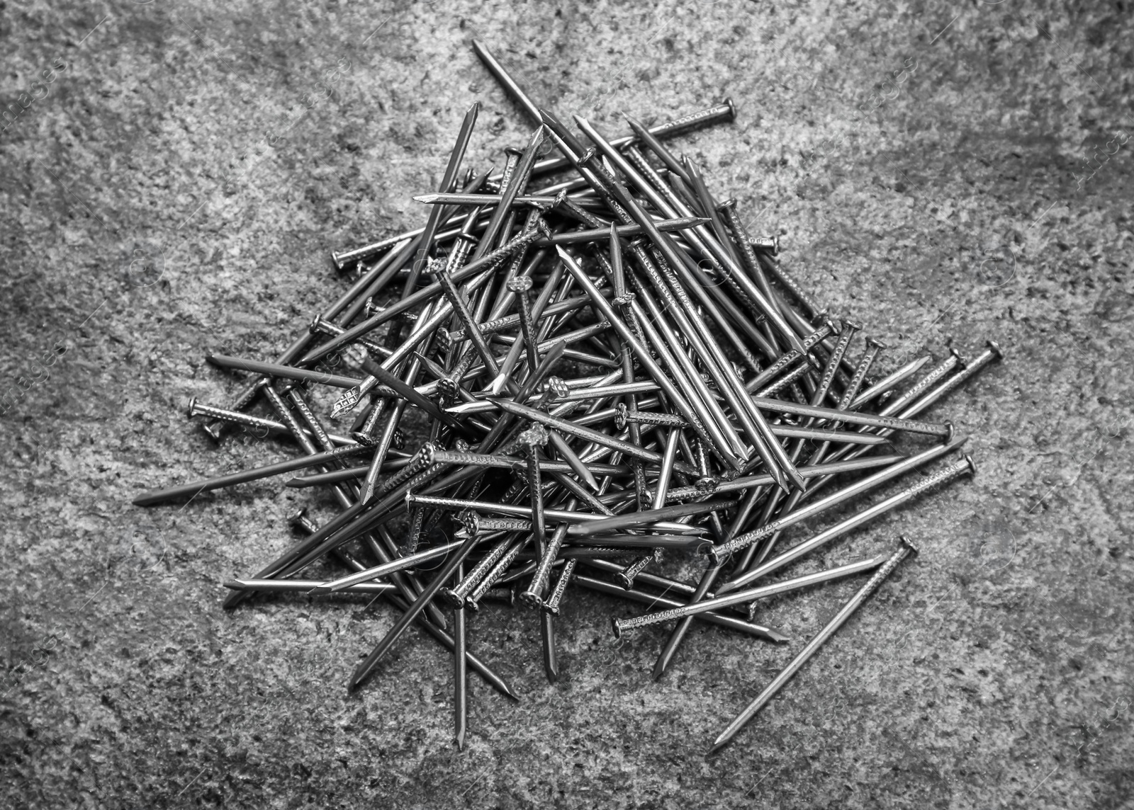 Photo of Many metal nails on grey background, flat lay