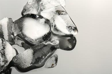 Photo of Pieces of crushed ice on mirror surface, closeup. Space for text