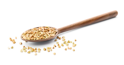 Photo of Uncooked green buckwheat grains in spoon isolated on white