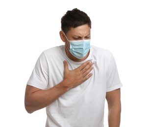 Photo of Man in medical mask suffering from pain during breathing on white background
