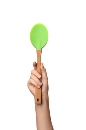 Woman holding kitchen utensil on white background