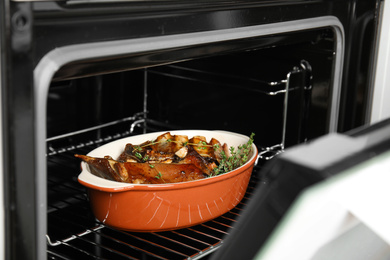 Photo of Delicious roasted ribs with thyme in oven