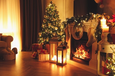 Beautiful room interior with fireplace and Christmas decor in evening