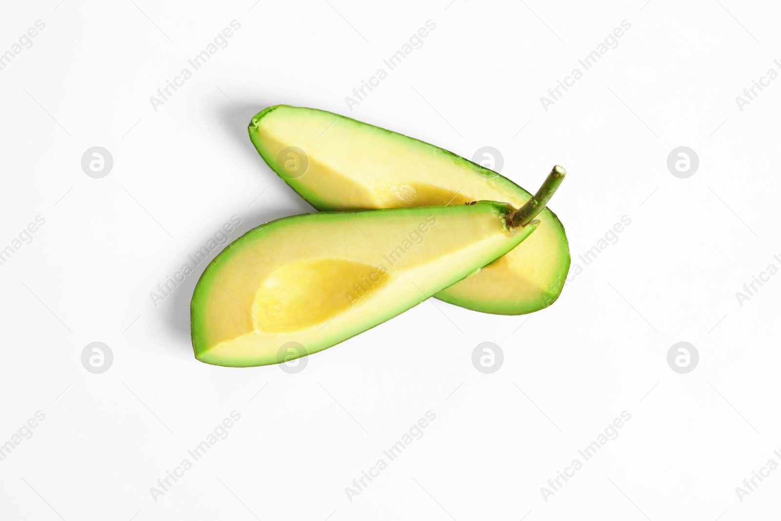 Photo of Slices of avocado on white background