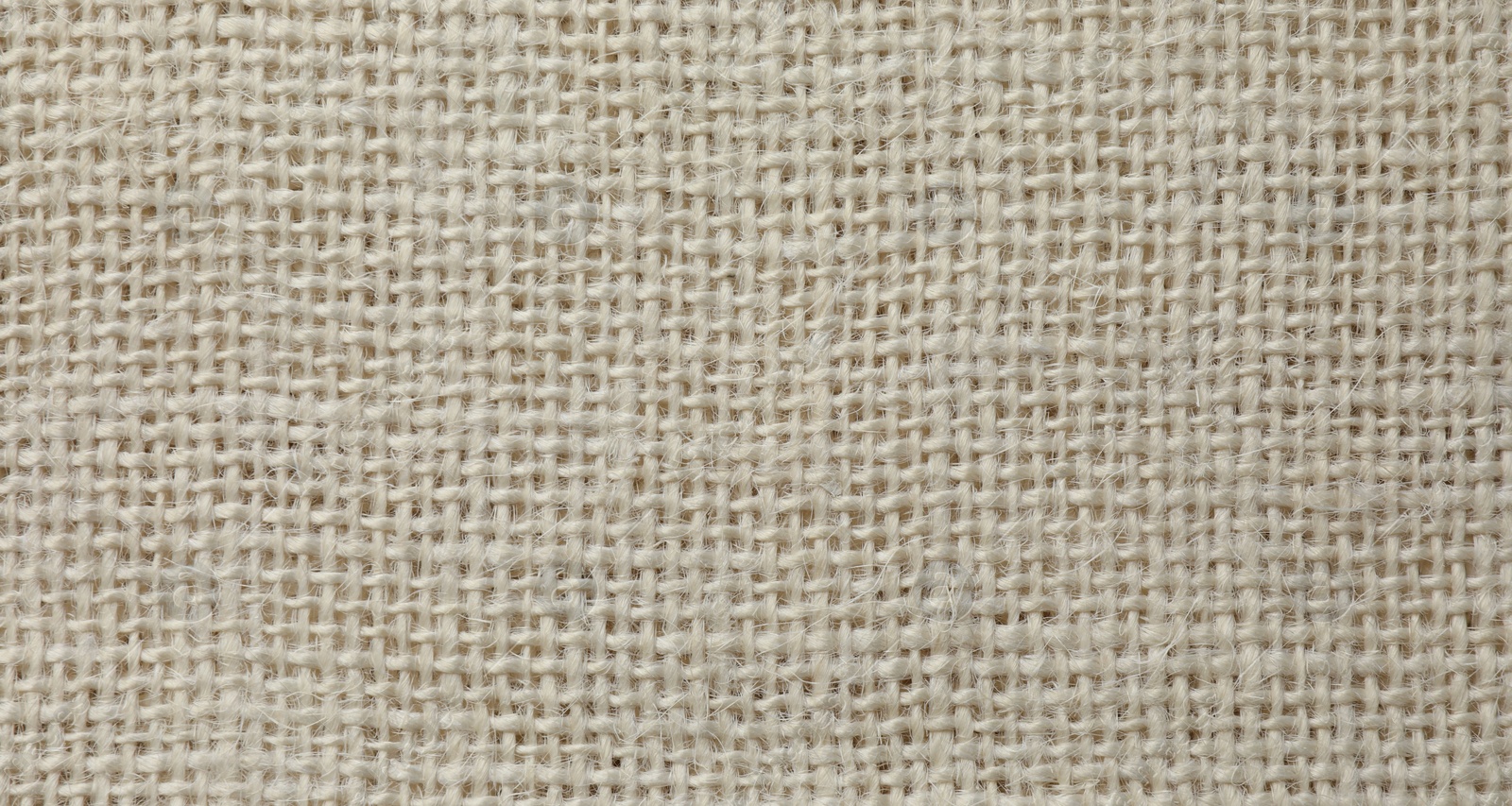 Photo of Texture of beige fabric as background, top view